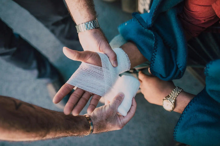 man getting hand wound wrapped