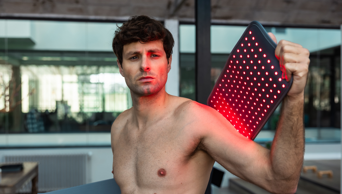 Athlete treating their shoulder with the Novaa LightPad after a CrossFit session